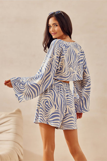 Stylish Bianca Roco Fashion blouse showcasing a lightweight, loose fit design ideal for summer, crafted from a delicate blend of viscose and linen, perfect for elegant summer outfits.