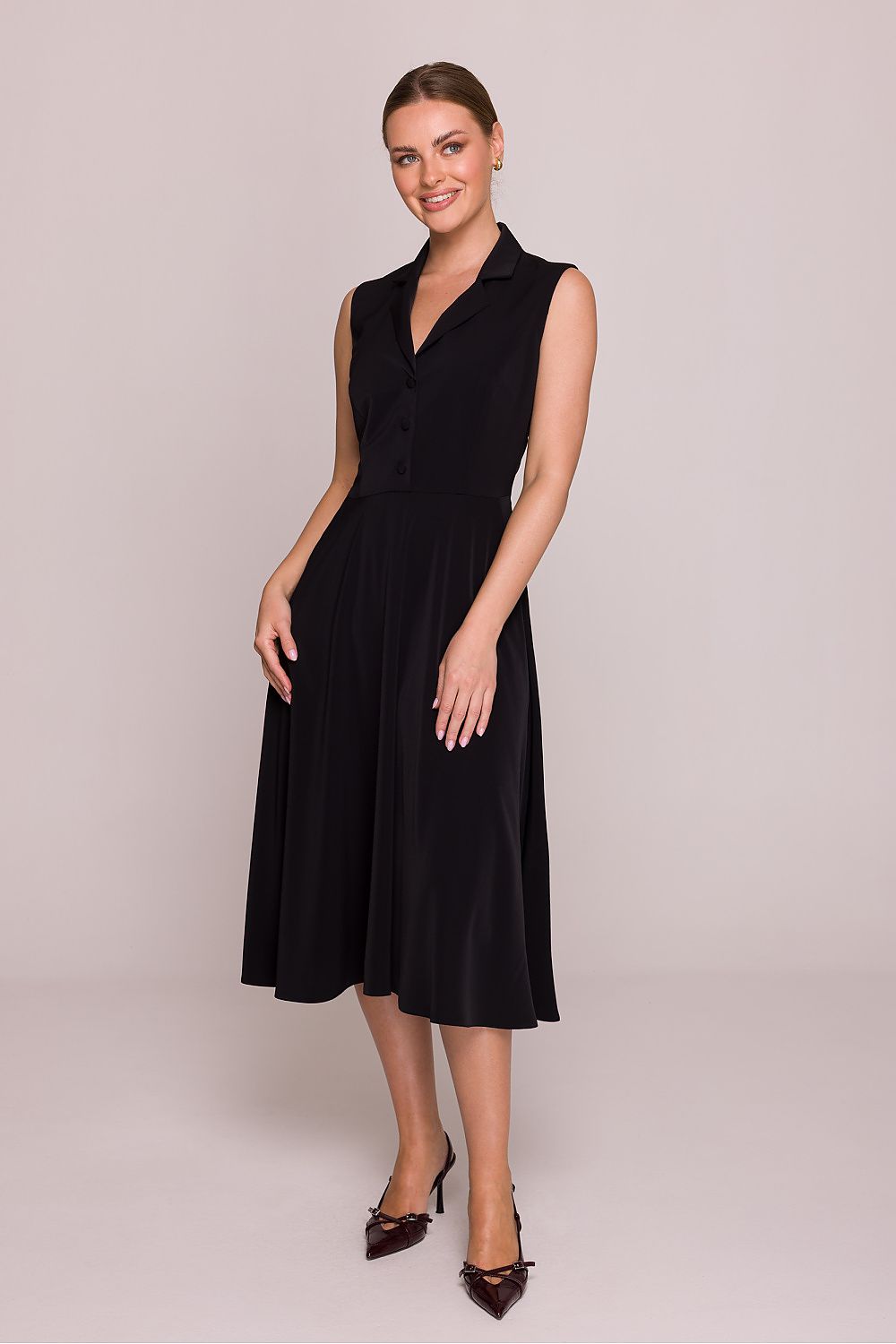 Elegant side view of the Stylove midi dress, emphasizing its beautiful silhouette and practical side pockets, perfect for any special occasion.