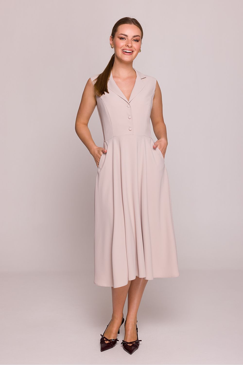 Stylove Midi Cocktail Dress showcasing an elegant V-neckline and fitted top flowing into a flared bottom, perfect for special occasions and crafted in Poland.