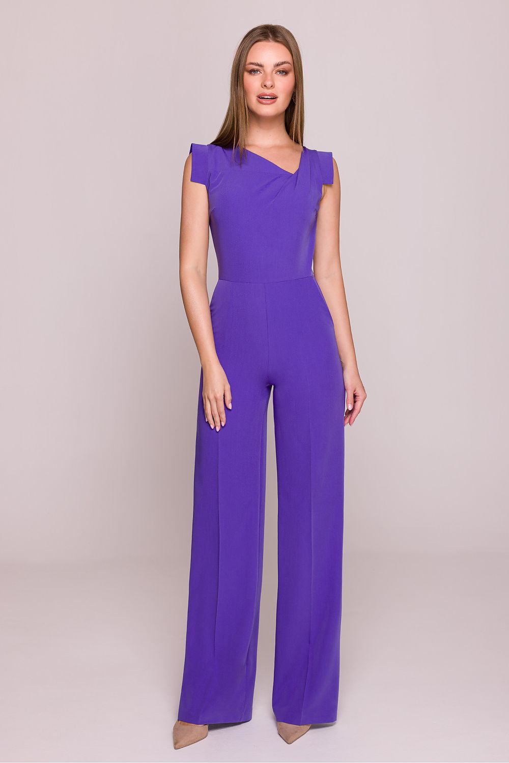 Stylove jumpsuit model wearing stylish asymmetrical neckline and flattering high waist, ideal for evening events.