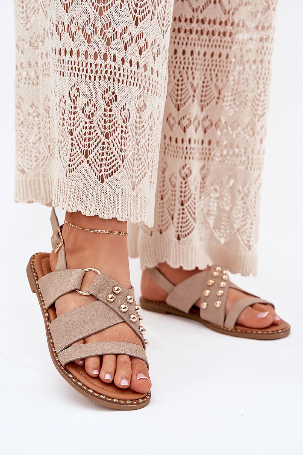 Sophisticated women's eco suede sandals from Step in Style with adjustable strap, designed for comfort and style, featuring luxe gold studs.