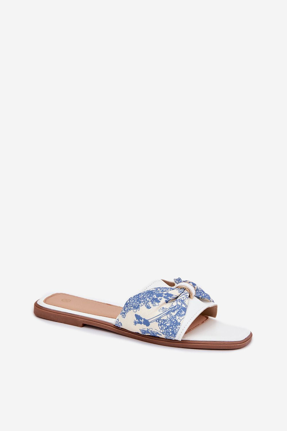 Close-up of Step in style flat heel sandals featuring a stylish bow, crafted from artificial leather for luxury summer wear.