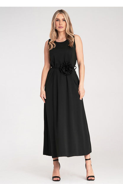 Close-up of the floral details and belt on Figl's sleeveless maxi dress, highlighting its luxurious style.