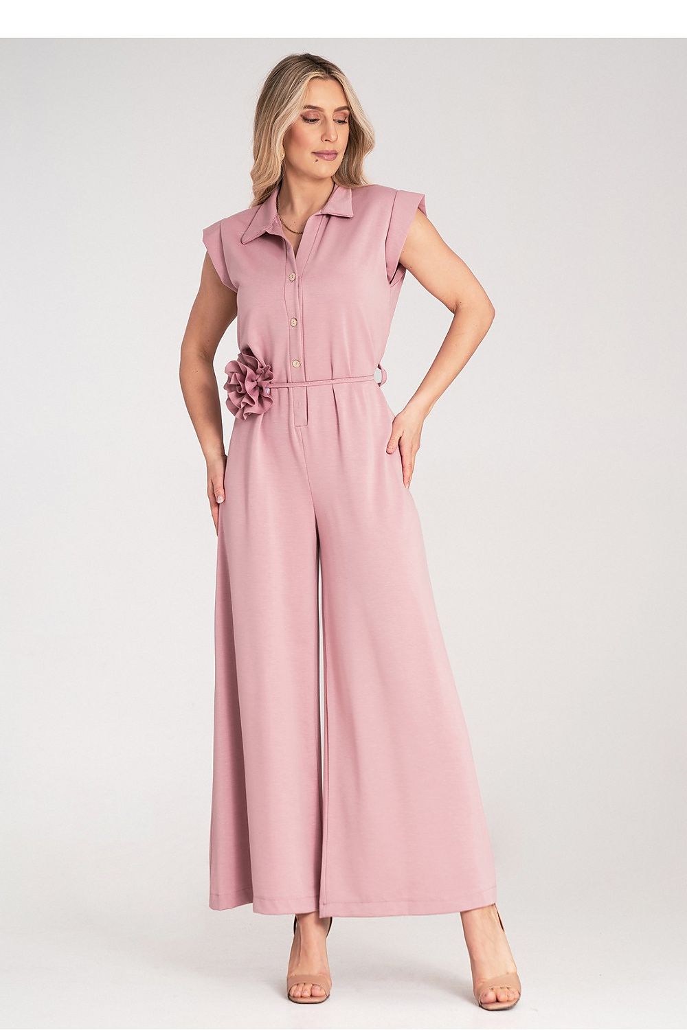 Chic Figl luxury jumpsuit with belt, decorative flower, and slightly elongated shoulder line for a refined look.