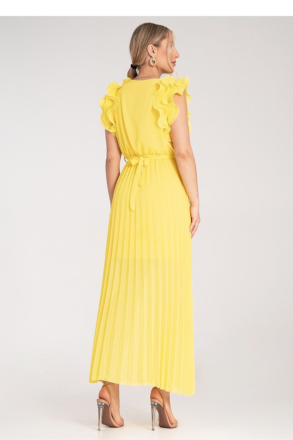 Back view of the Figl maxi dress showcasing its fabric belt, elastic band waist, and flowy pleats.