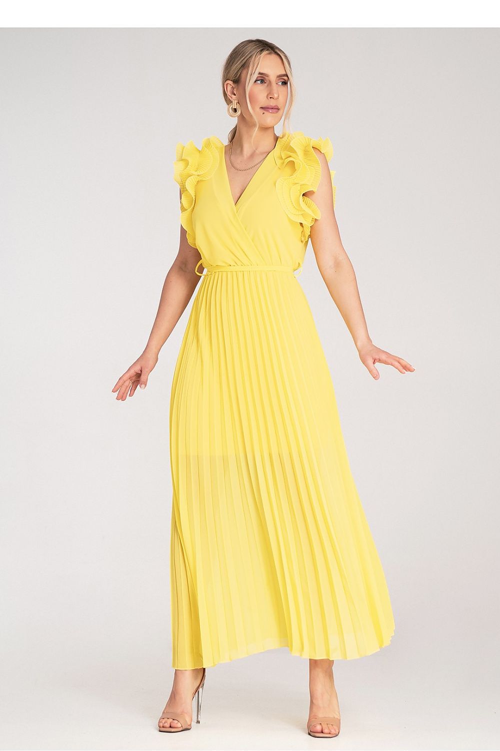 Side angle of the Figl maxi dress illustrating the exquisite design of the ruffles and the lightweight fabric movement.