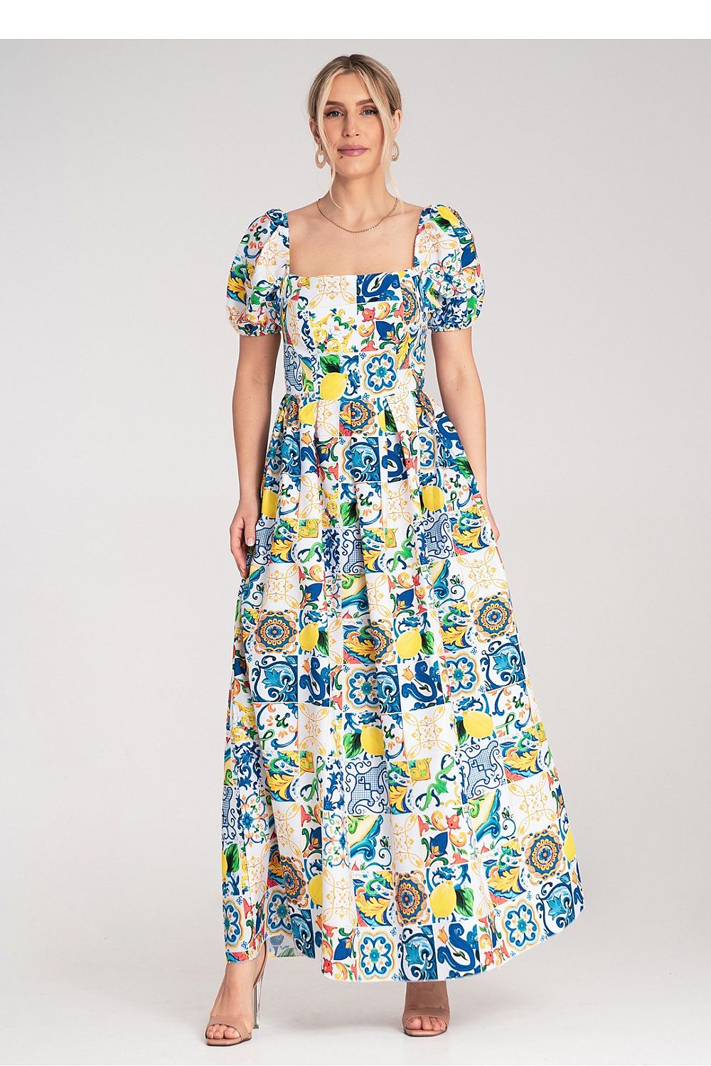 Luxurious Figl maxi dress featuring a vibrant tile pattern, designed with short puffy sleeves and a sophisticated square neckline.