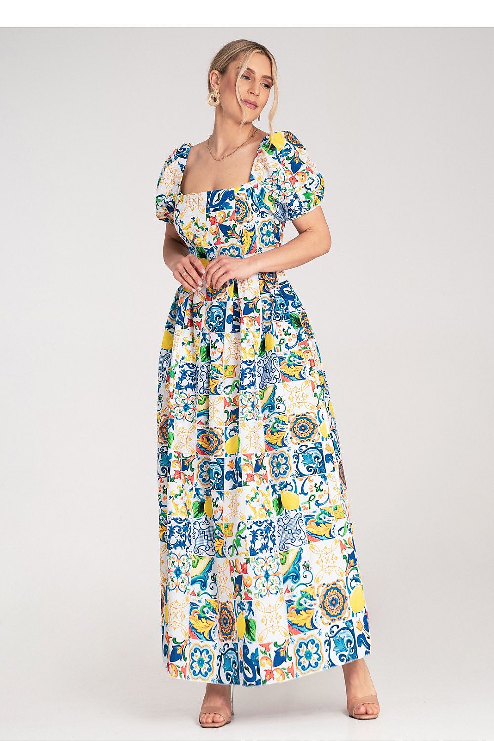 Elegant Figl maxi dress showcasing a fitted bodice and flared skirt, crafted from smooth fabric with an eye-catching ceramic tile design.