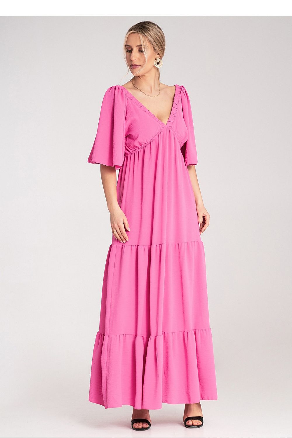 Elegant Figl maxi dress featuring a deep V-neck, cutout back, and ruffled hem, ideal for formal occasions.