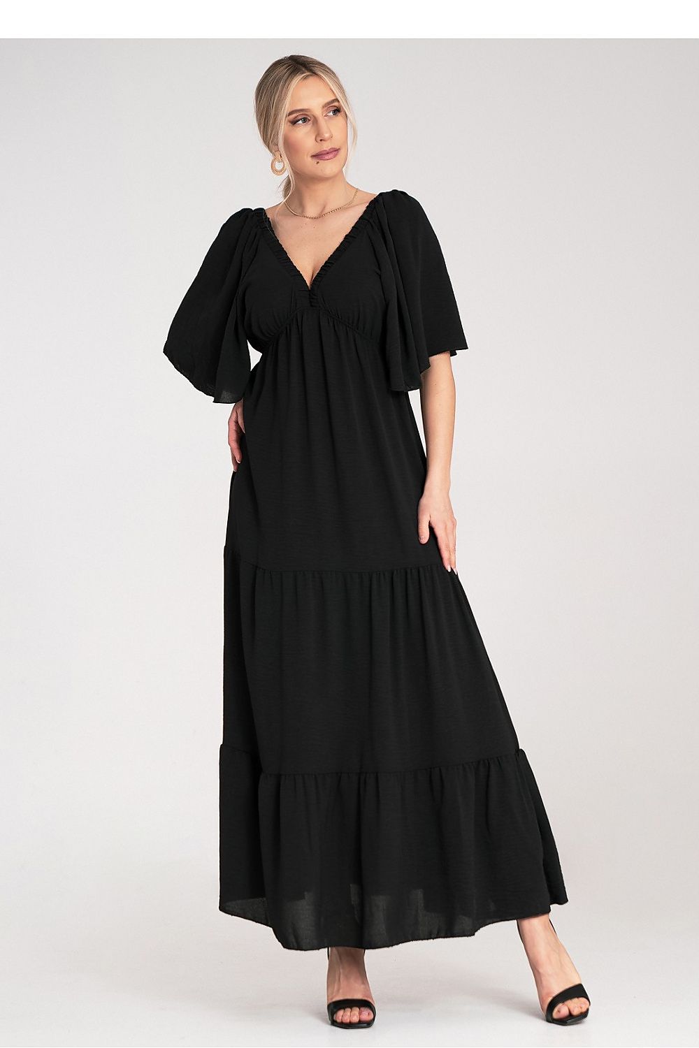 Chic Figl maxi dress showcasing short, loose sleeves and a stylish cutout back with a ribbon tie, perfect for summer events.