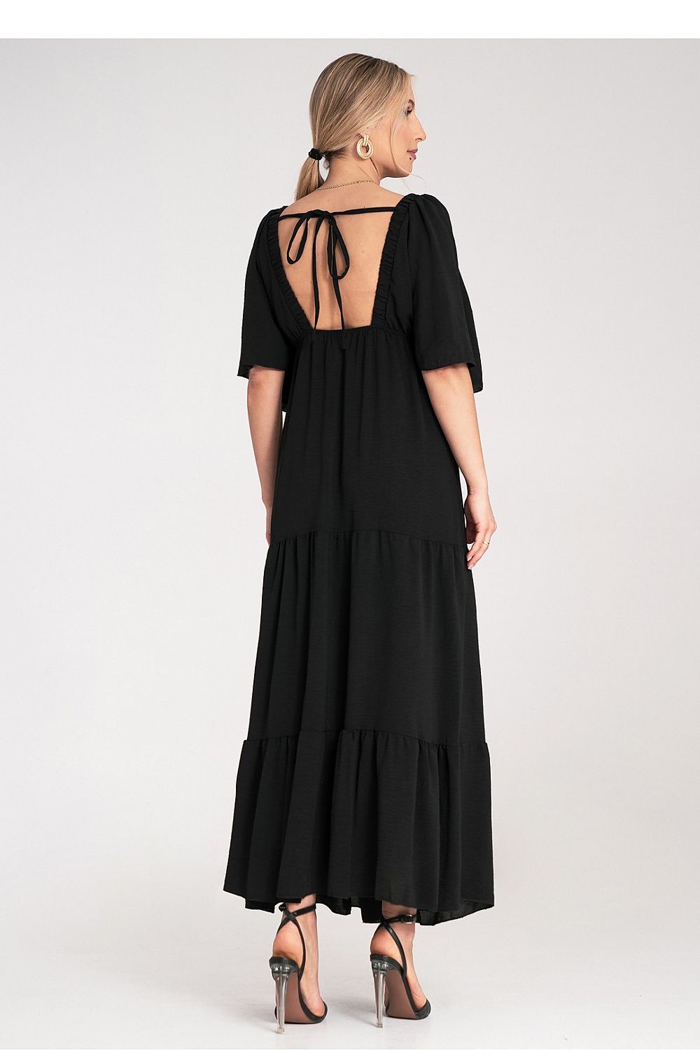 Breathtaking Figl maxi dress highlighting its flowing ruffled hem and flattering V-neckline, an exquisite choice for evening wear.