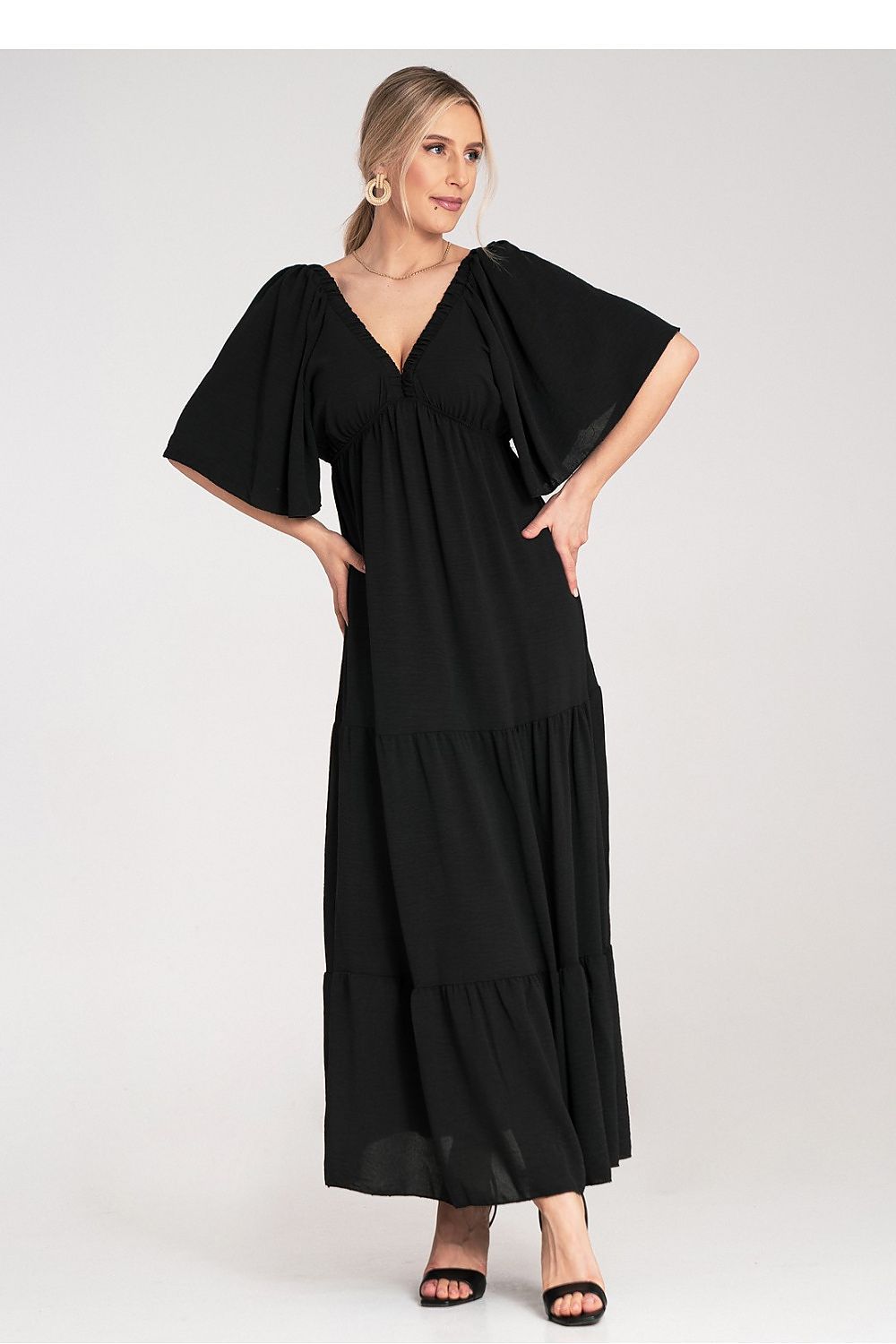 Stunning Figl maxi dress that combines comfort and elegance with its unique back design and textured ruffles, perfect for upscale gatherings.