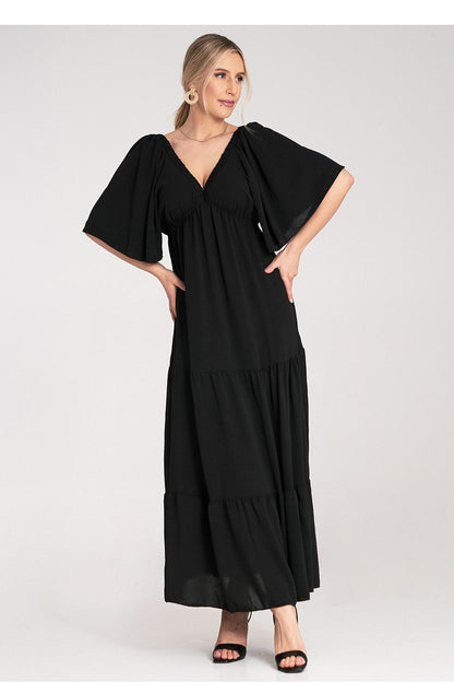 Stunning Figl maxi dress that combines comfort and elegance with its unique back design and textured ruffles, perfect for upscale gatherings.