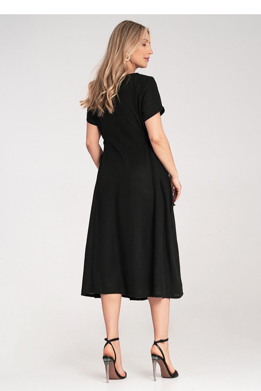 Close-up of Figl midi dress detailing, featuring delicate side strings for fabric gathering, enhancing a refined silhouette.