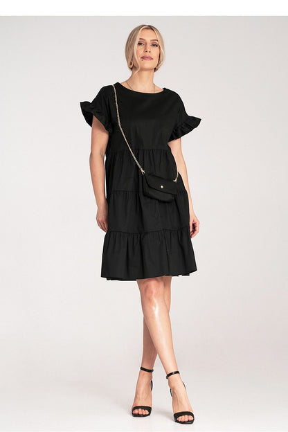 Figl Mini Ruffle Daydress accessorised with a matching small bag on a gold chain, a luxurious addition to the summer wardrobe.