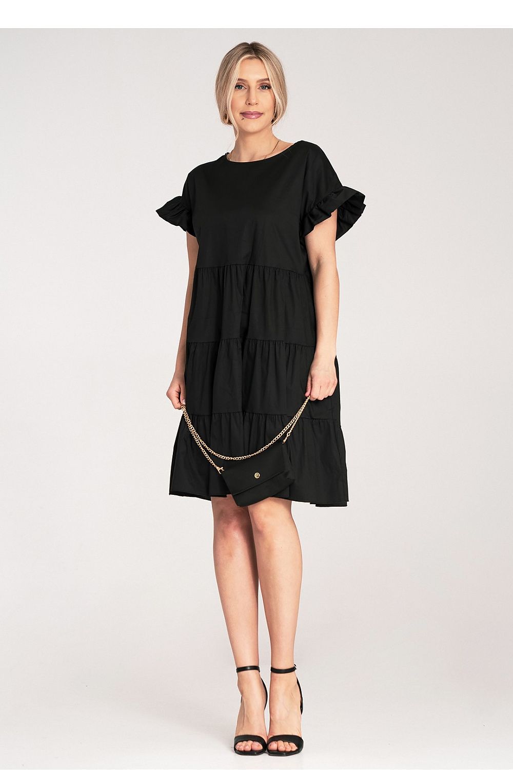 Luxury Figl Mini Ruffle Daydress in Light Cotton featuring a loose fit and short sleeves, displayed elegantly on a mannequin.
