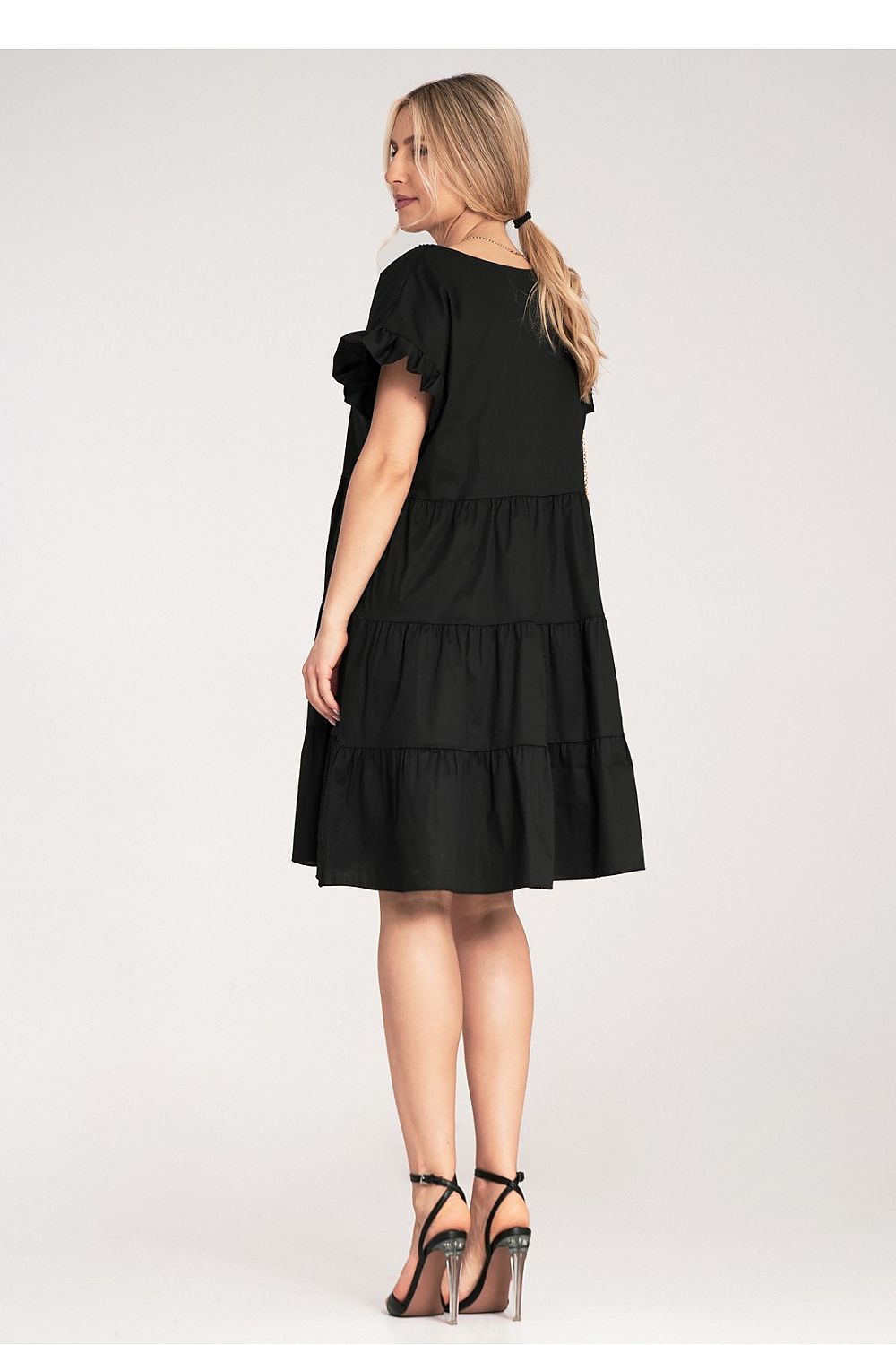 Close-up of Figl's exquisite Mini Ruffle Daydress detailing, showcasing the soft cotton fabric and decorative ruffles in a stylish light hue.