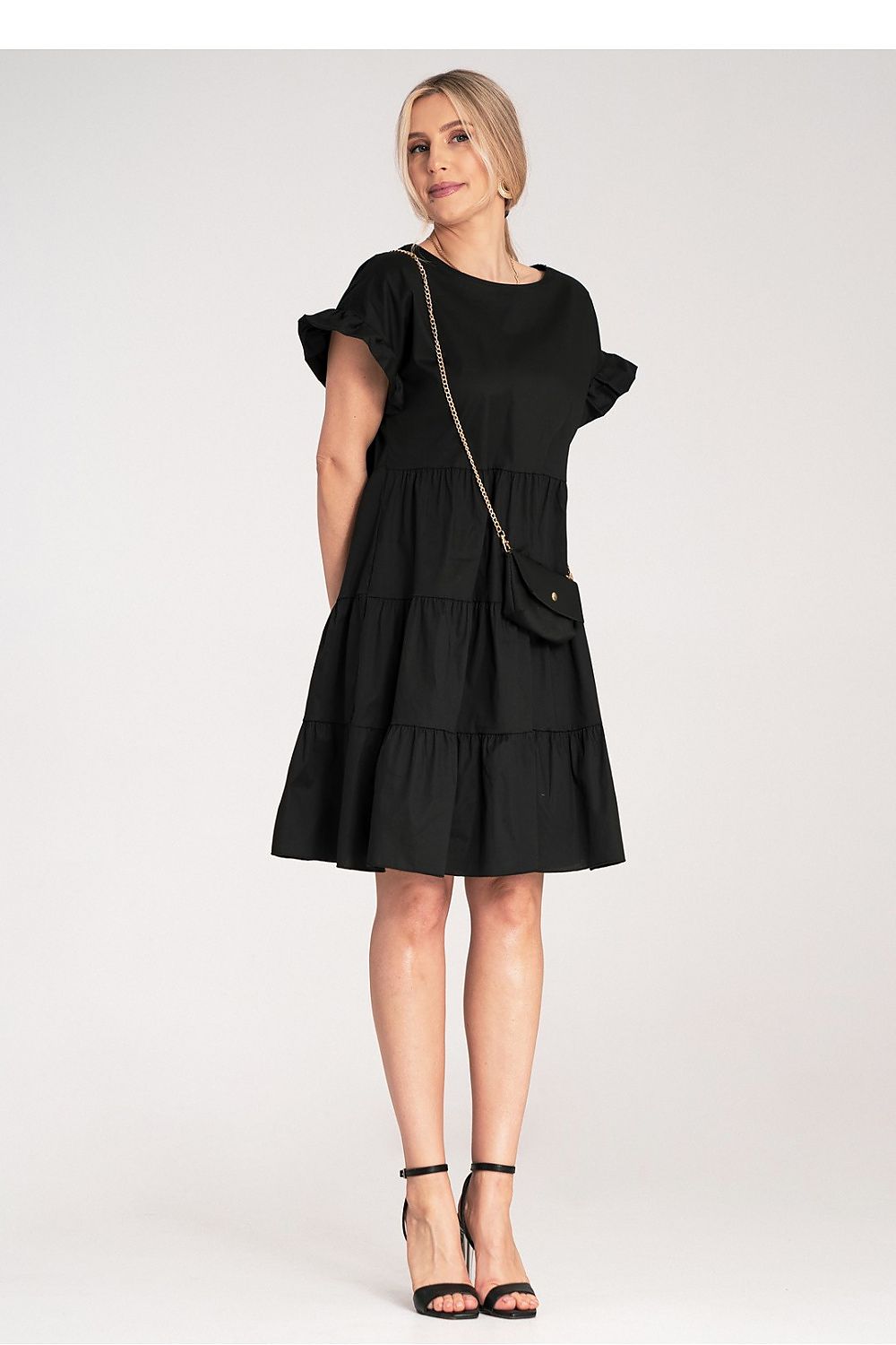 Full-length view of the sophisticated Figl Mini Ruffle Daydress, highlighting its flared bottom and charming ruffle accents, perfect for a summer outing.