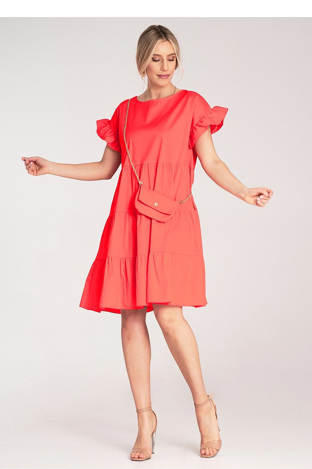 Styled image of the Figl Mini Ruffle Daydress, highlighting its versatile design and chic short sleeves, suitable for various occasions.