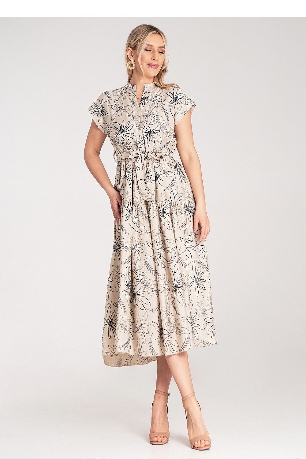 Flat lay of the Figl Midi Dress displaying its high-quality fabric and intricate floral motif.