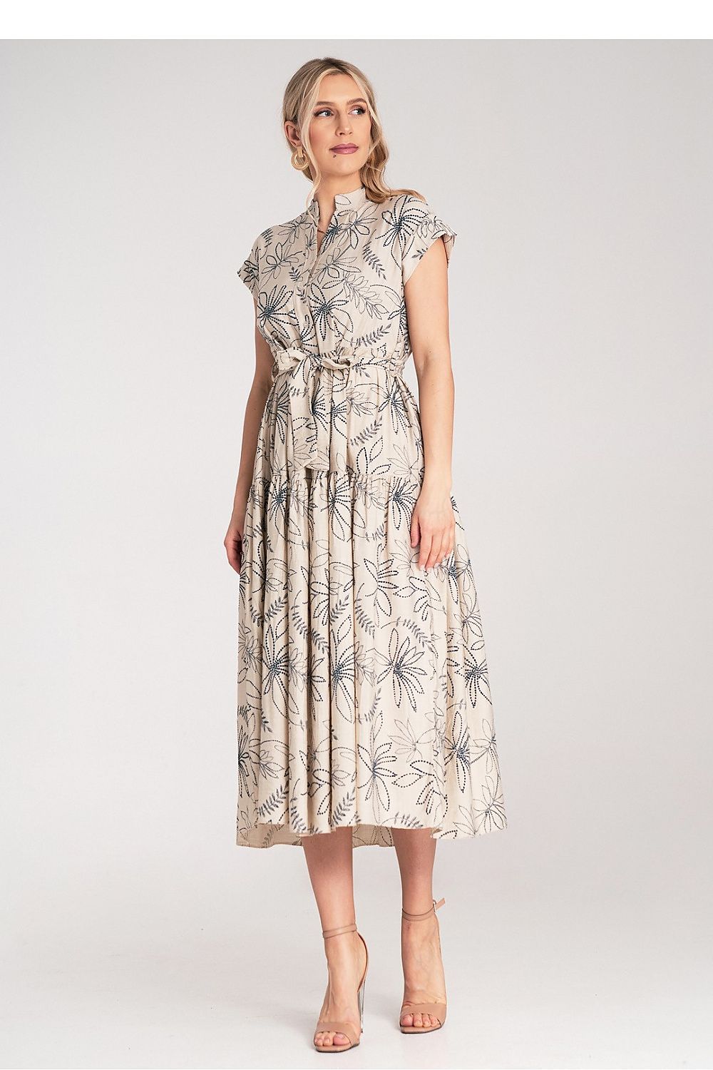 Stylish Figl midi dress featuring embossed white floral patterns, a flattering waist belt, and a ruffled hemline, epitomising luxury fashion.