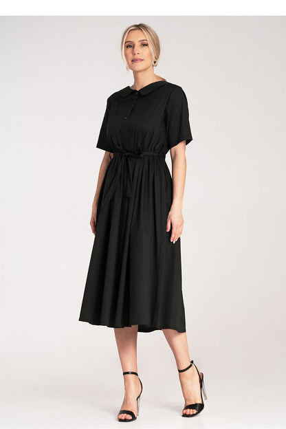 Close-up view of Figl's exquisite shirt fabric used in an elegant midi-length daydress, ideal for a luxurious daytime look.