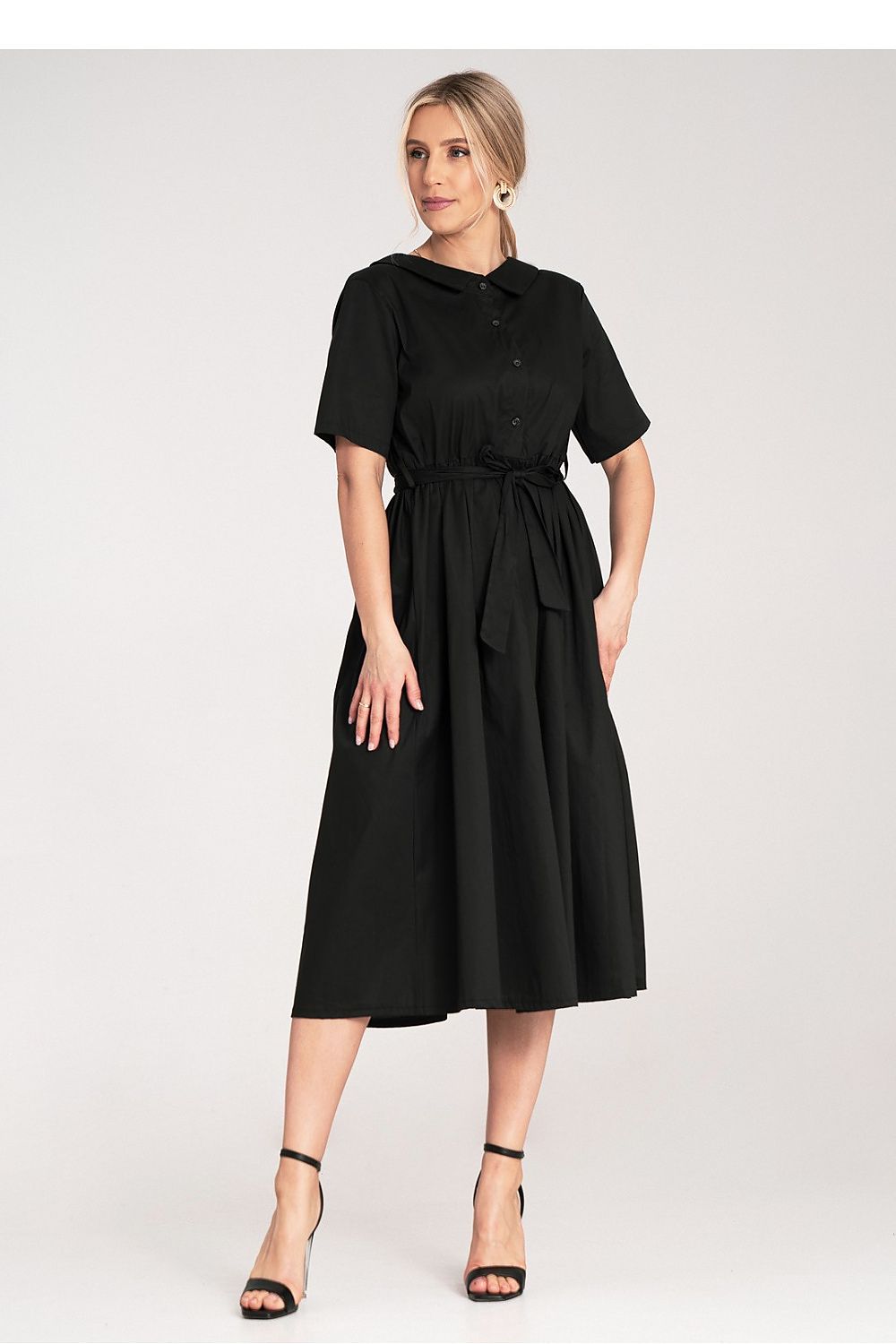 Beautifully styled cotton daydress by Figl, complete with a matching belt, embodying elegance and comfort in its A-line design.