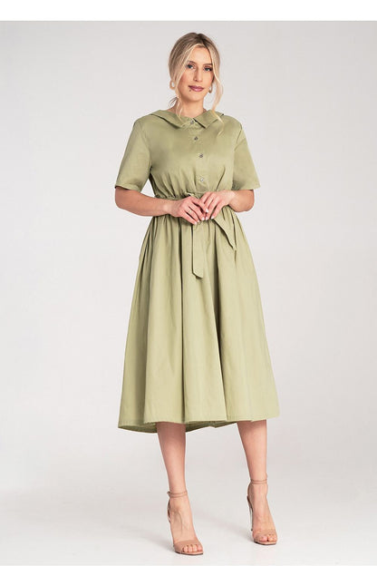 Chic Figl cotton daydress styled with a belt, showcasing a flared bottom with graceful pleats, perfect for a luxurious daytime look.