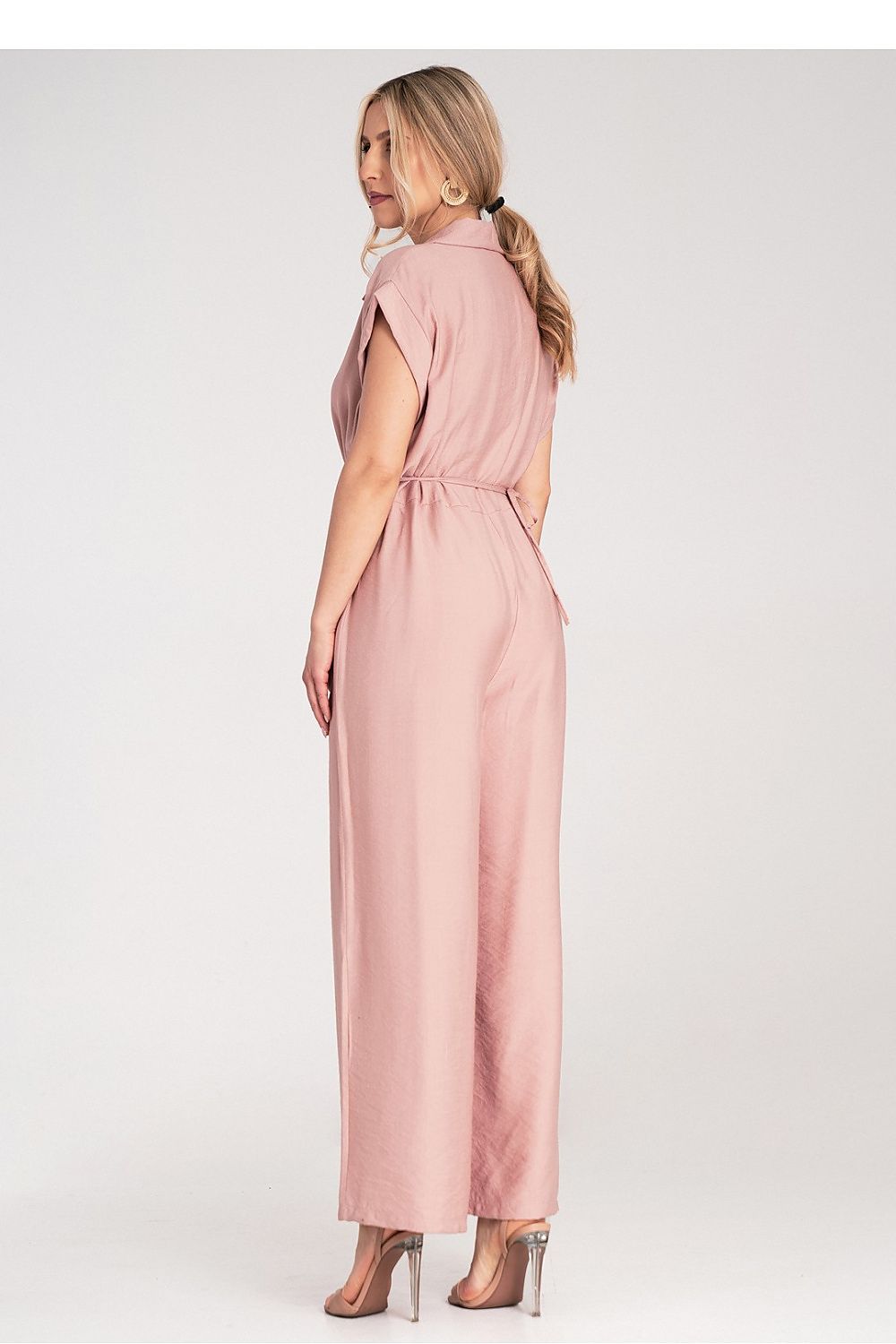 Close-up of Figl Floral Detail Wide-Leg Jumpsuit featuring a decorative floral application at the waist, encapsulating sophisticated style and comfort.