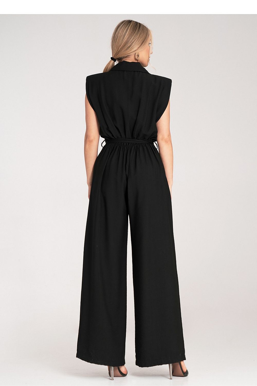 Luxury Figl jumpsuit featuring wide legs, a collar, padded shoulders, and a tied belt, showcasing sophisticated design for elegant occasions.