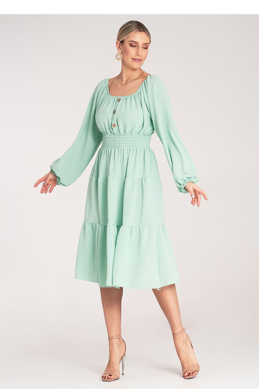 Close-up of Figl's elegant midi daydress showcasing unique wooden buttons and an elastic waistband for a flattering fit.