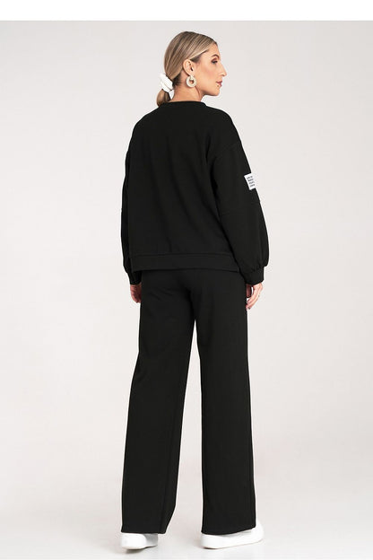 Luxurious black tracksuit set by Figl featuring a loose sweatshirt and wide pants, perfect for stylish comfort.