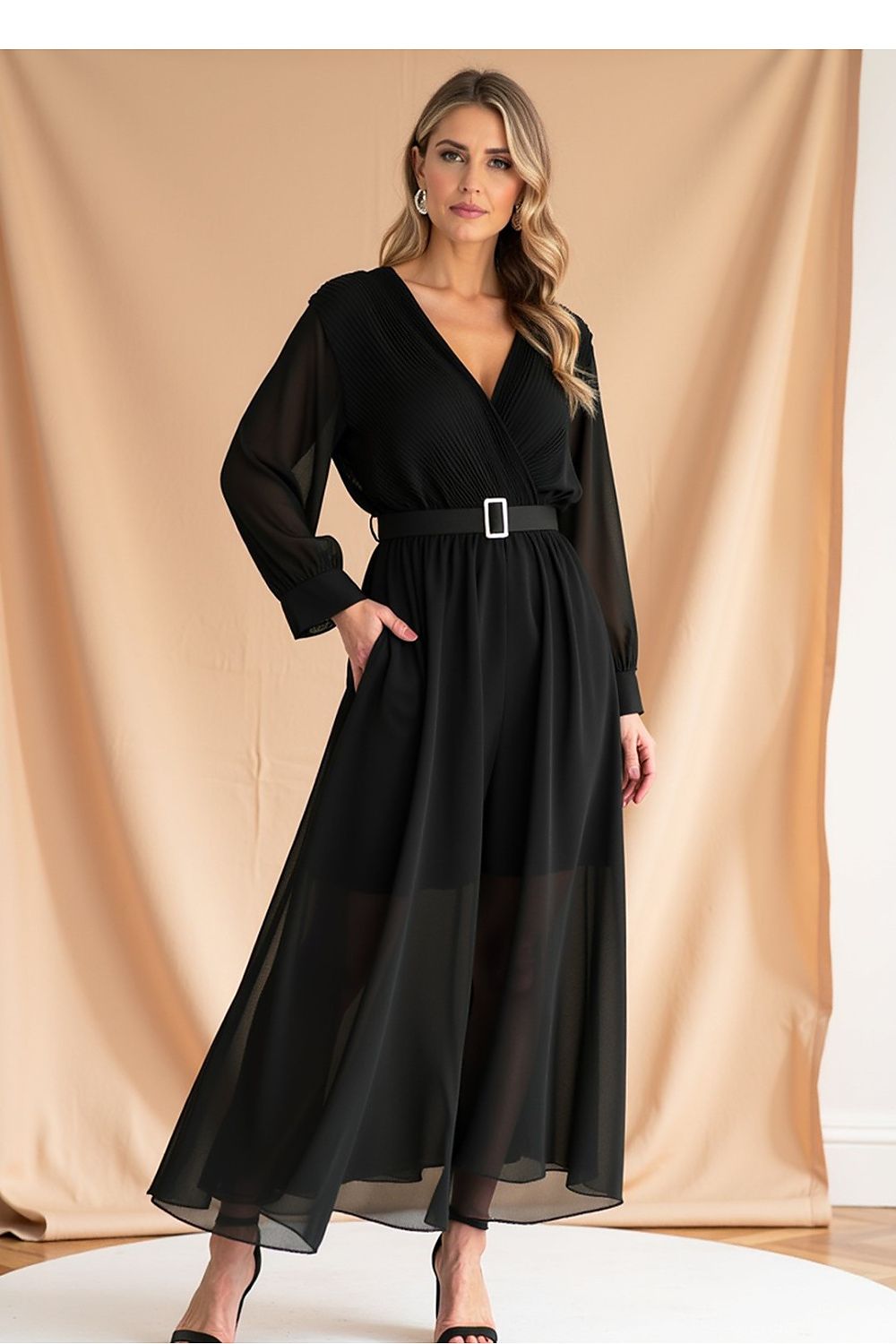 Figl exquisite maxi dress with belt detail at the waist, showcasing a stylish pleated design and long sleeves.