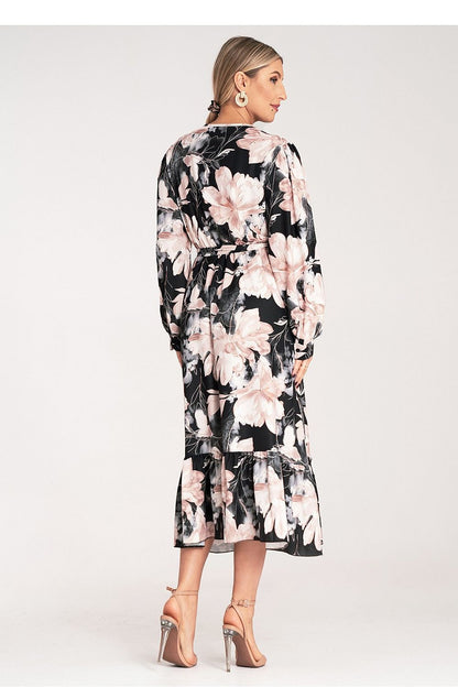 Side view of the Luxury Floral Maxi Dress by Figl, highlighting its tied waist and flowing silhouette.