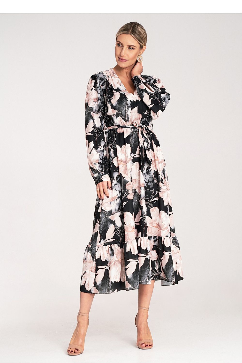 Back view of the Luxury Floral Maxi Dress by Figl, displaying the long sleeves with cuffs and stunning ruffle hem.