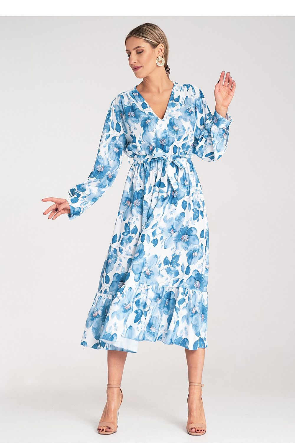 Figl's stunning Floral Maxi Dress with long sleeves and a tied waist, capturing a sophisticated and feminine style.