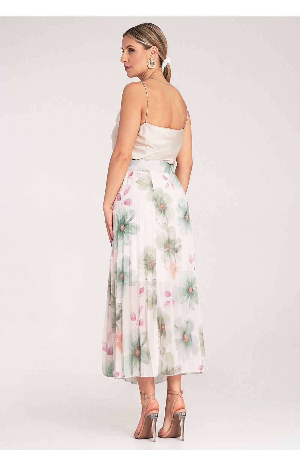 Detailed shot of the fabric texture of Figl's Elegant Floral Pleated Midi Skirt, illustrating the quality and elegance of the material.