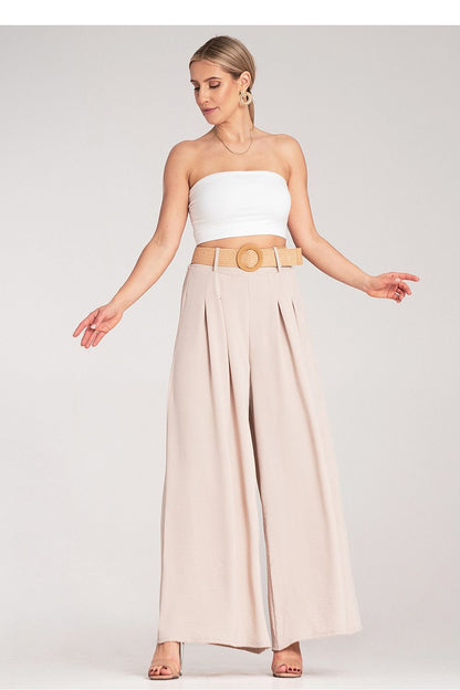 Close-up of Figl's luxury wide trousers with a high waist and decorative woven belt, emphasizing the elegant pleats and premium fabric.