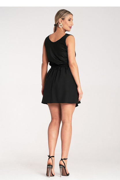 Elegant pleated mini skirt by Figl, featuring an elastic waistband in a luxurious design, perfect for sophisticated occasions. Size EU S/M | US S/M.