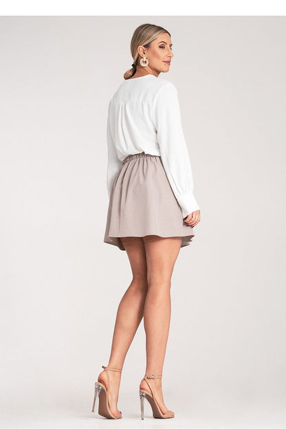 Elegant Women's Mini Skirt by Figl styled for a chic outfit, emphasising versatility and sophistication.