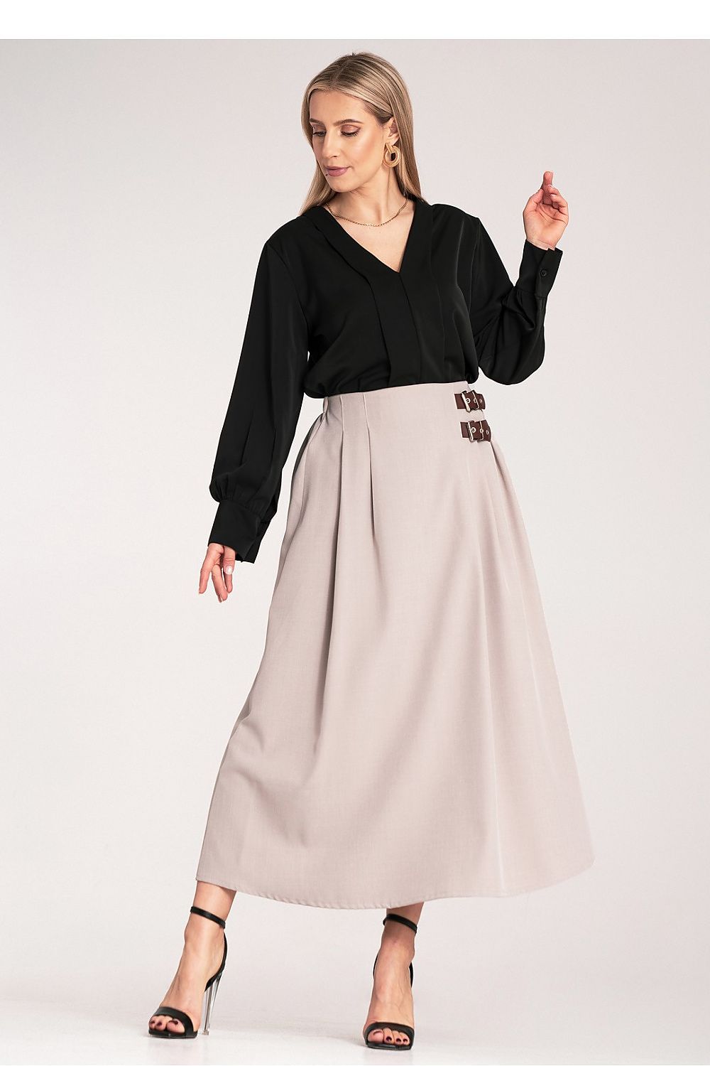 Side view of Figl Midi Skirt showcasing luxurious pleats and refined side buckles, designed for the modern woman.