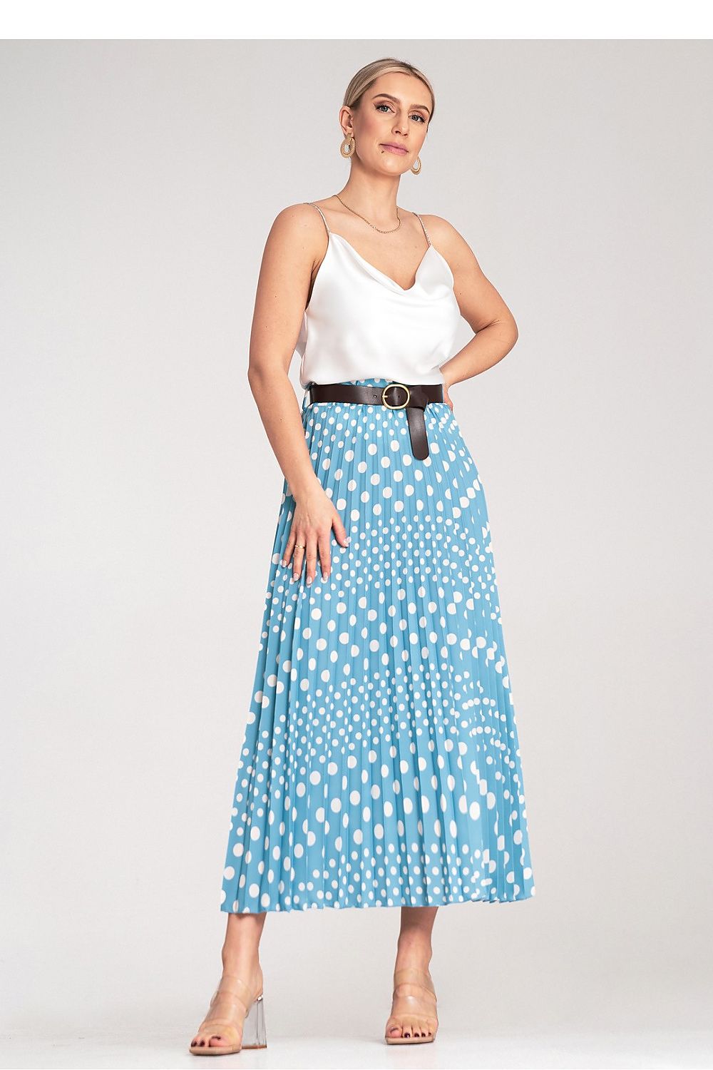 Close-up of the stylish buckle belt on the Figl pleated midi skirt with white polka dots, showcasing fine detailing.