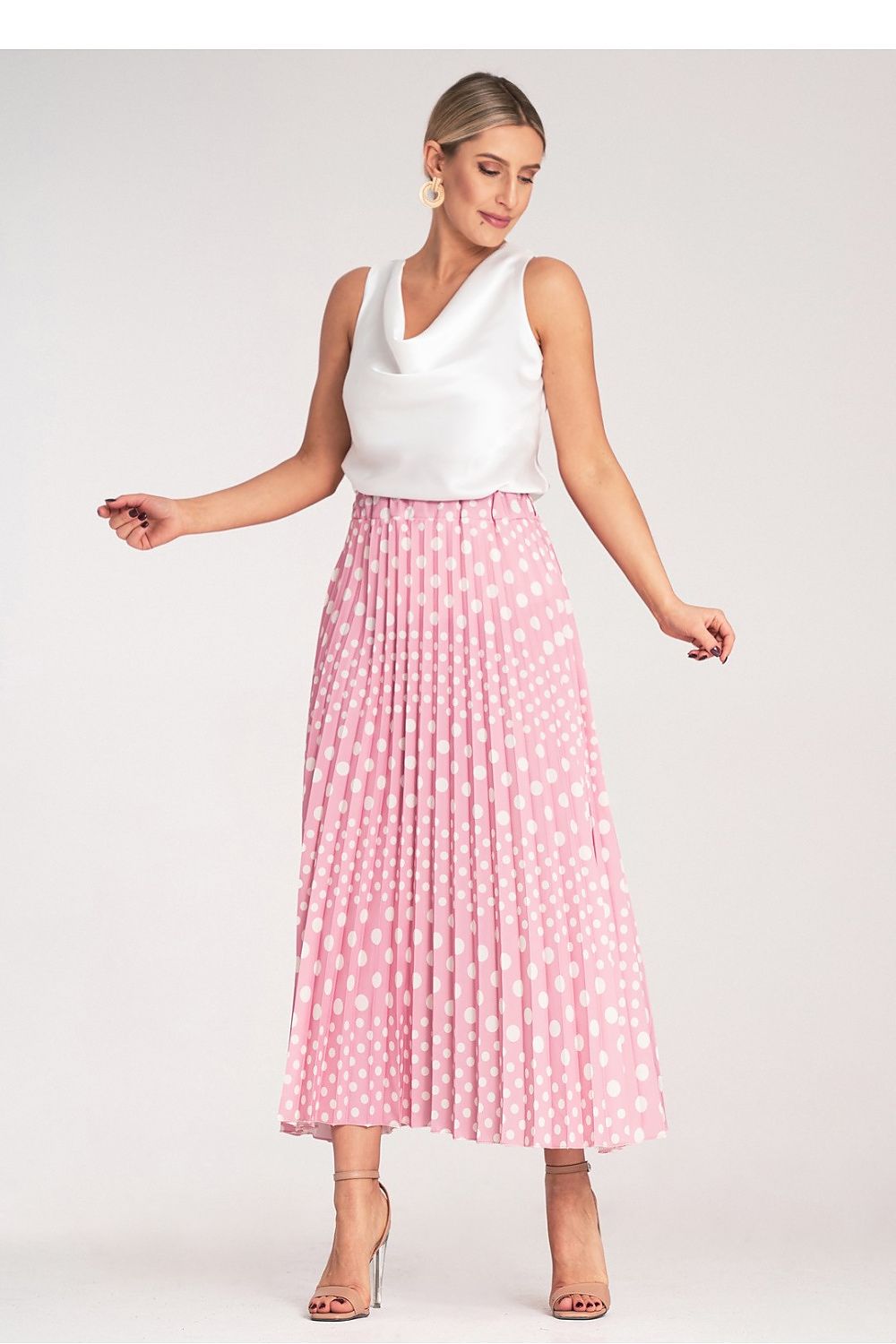 Elegant pleated midi skirt from Figl adorned with classic white polka dots, showcasing a high-waisted design.