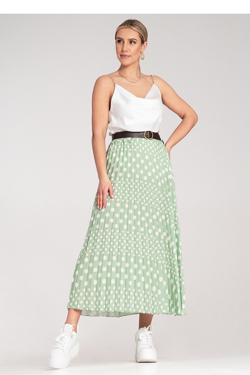 Full outfit display featuring Figl's elegant pleated midi skirt with white polka dots, perfect for sophisticated and luxurious styling.