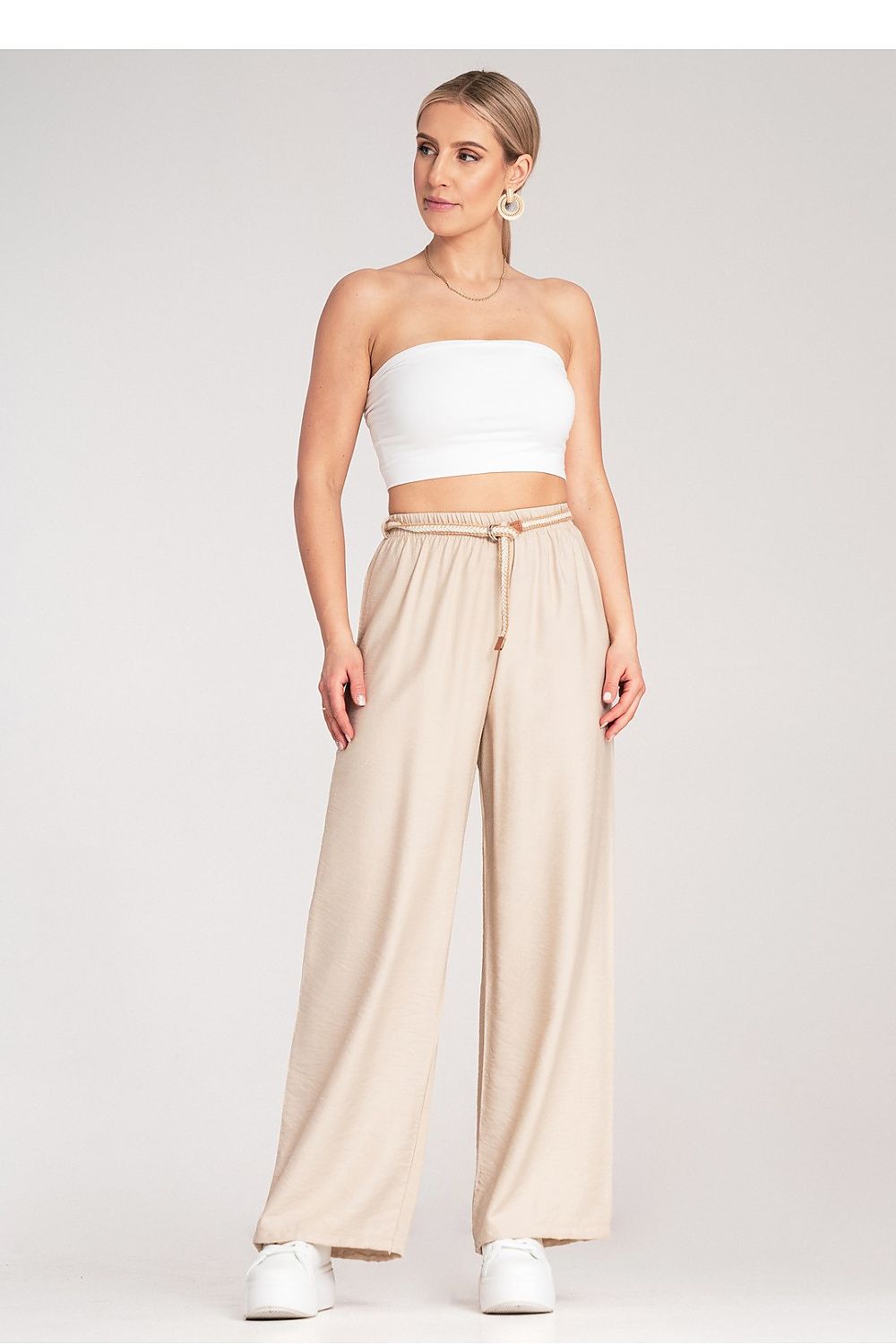 Close-up of Figl’s luxury Boho trousers showcasing the intricate braided belt detail and breathable fabric.