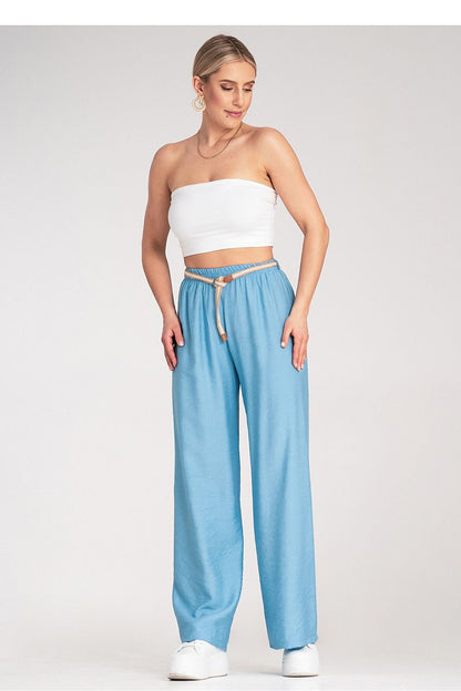 Luxurious Boho trousers by Figl, displayed elegantly alongside accessories, embodying a chic and relaxed style.