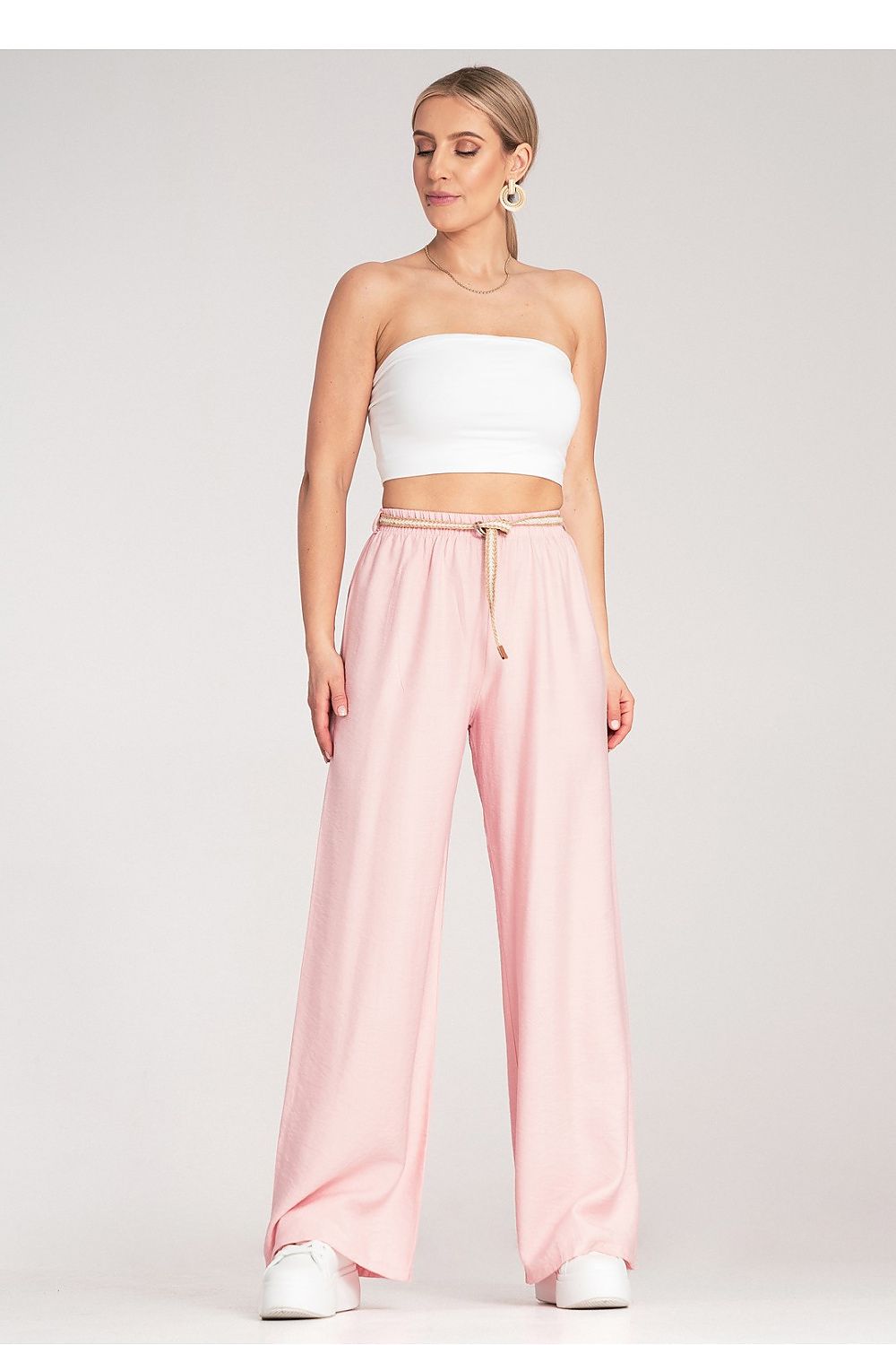 Model wearing Figl's luxury boho trousers, styled for a casual yet elegant look, perfect for warm weather outings.