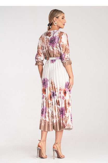 Elegant floral maxi dress by Figl showcasing pleated details and an elastic waist for a flattering fit.