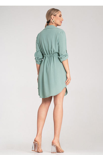 Model wearing the Figl Classic Button-Up Shirt Dress, illustrating the versatility of the adjustable sleeves rolled up for a casual yet sophisticated look.