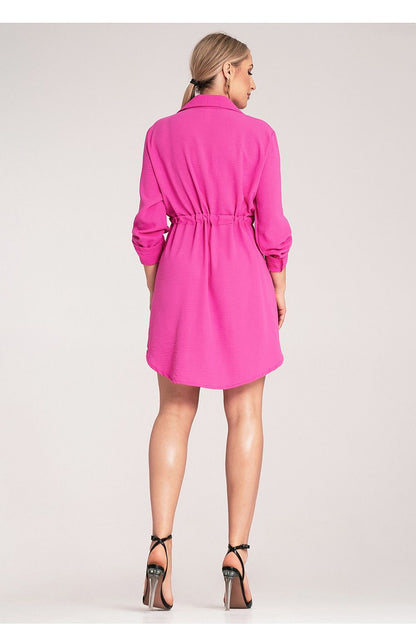 Stylish Figl shirt dress with a classic collar, showcasing two chest pockets and a tailored waist tie for a sophisticated look.